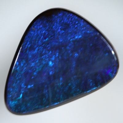 SOLID BOULDER OPAL Bright turquoise blue sparkles over deep ocean blue